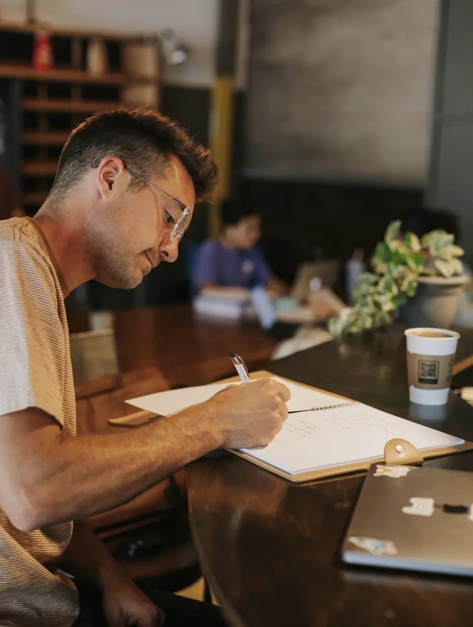 Tyler Lingle working through a buyer plan at a coffee shop